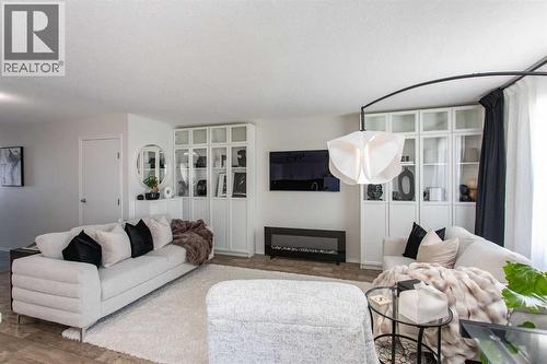 4, 20 Jacobs Close, Red Deer, AB - Indoor Photo Showing Living Room With Fireplace
