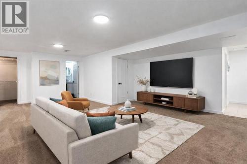 Image is Virtually Staged - 10219 Maplebrook Place Se, Calgary, AB - Indoor Photo Showing Living Room