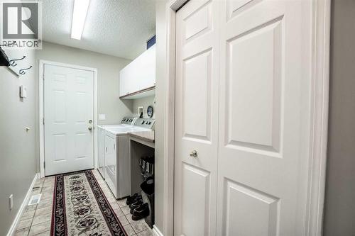 Laundry Room/Entrance from Garage - 509 Highview Point Nw, High River, AB - Indoor Photo Showing Laundry Room