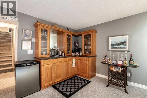 Custom corner wet bar - 509 Highview Point Nw, High River, AB - Indoor