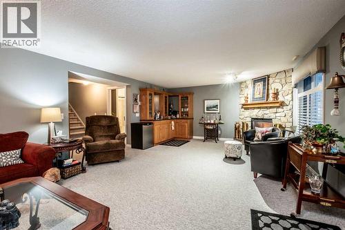 Large area - 509 Highview Point Nw, High River, AB - Indoor Photo Showing Living Room With Fireplace