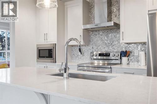 117, 30 Walgrove  Se, Calgary, AB - Indoor Photo Showing Kitchen With Upgraded Kitchen