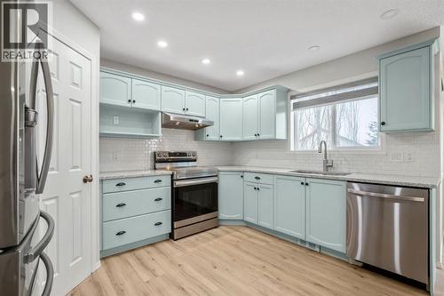 104 Cove Crescent, Chestermere, AB - Indoor Photo Showing Kitchen With Stainless Steel Kitchen With Upgraded Kitchen