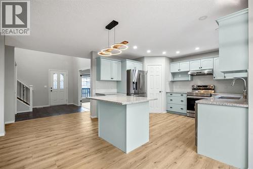 104 Cove Crescent, Chestermere, AB - Indoor Photo Showing Kitchen With Stainless Steel Kitchen With Upgraded Kitchen