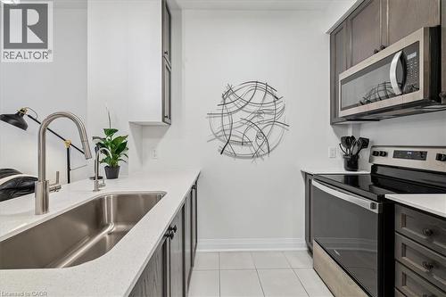 16 Concord Place Unit# 150, Grimsby, ON - Indoor Photo Showing Kitchen With Double Sink