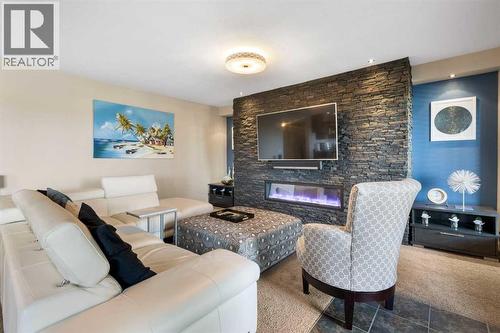 164 Hillcrest Boulevard, Strathmore, AB - Indoor Photo Showing Living Room With Fireplace
