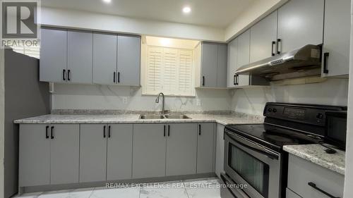 7479 Pickfair Drive, Mississauga, ON - Indoor Photo Showing Kitchen With Double Sink