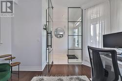 Den Overlooking Foyer - 