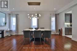 Dining Area With Custom Light Fixture & Potlights - 