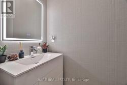 Powder Bathroom With Custom Wallpaper - 