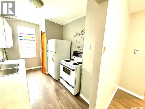1128 Garnet Street, Regina, SK - Indoor Photo Showing Kitchen With Double Sink
