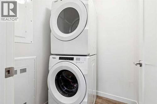 208, 30 Shawnee Common Sw, Calgary, AB - Indoor Photo Showing Laundry Room