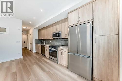 7320, 1802 Mahogany Boulevard Se, Calgary, AB - Indoor Photo Showing Kitchen With Stainless Steel Kitchen