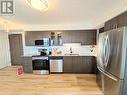 718 - 75 Norman Bethune Avenue, Richmond Hill, ON  - Indoor Photo Showing Kitchen With Double Sink 