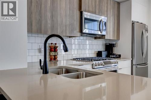 888 Walgrove Boulevard Se, Calgary, AB - Indoor Photo Showing Kitchen With Double Sink With Upgraded Kitchen