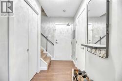 Entry space with a closet and bathroom to one side - 
