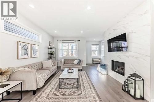159 Evanscrest Park Nw, Calgary, AB - Indoor Photo Showing Living Room With Fireplace