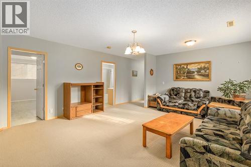 131 Panatella Close Nw, Calgary, AB - Indoor Photo Showing Living Room