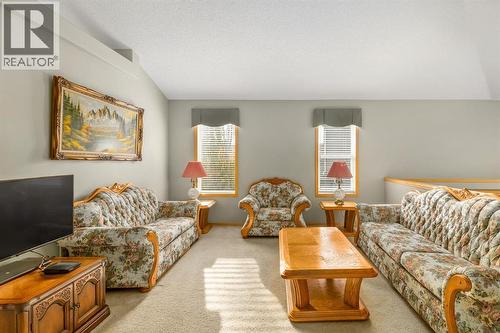 131 Panatella Close Nw, Calgary, AB - Indoor Photo Showing Living Room
