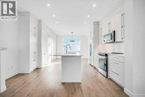 293 Dawson Way, Chestermere, AB - Indoor Photo Showing Kitchen With Upgraded Kitchen