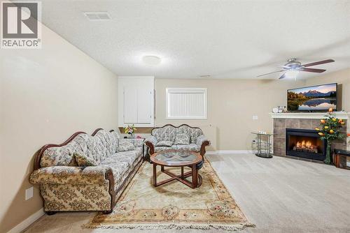 81 Saddlemont Road Ne, Calgary, AB - Indoor Photo Showing Living Room With Fireplace