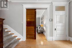 Wood sliding doors lead to the living room. - 