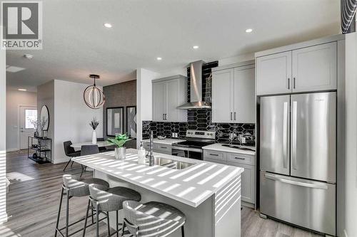 592 Buffaloberry Manor Se, Calgary, AB - Indoor Photo Showing Kitchen With Stainless Steel Kitchen