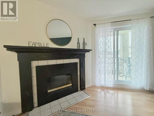 217 - 737 Deveron Crescent, London South (South T), ON - Indoor Photo Showing Living Room With Fireplace