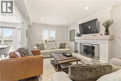 Living area with a fireplace and recessed lighting - 697 Lambshead Drive, Burlington, ON - Indoor Photo Showing Living Room With Fireplace