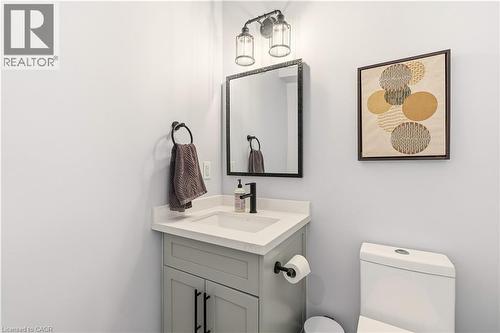 Half bathroom featuring vanity and toilet - 697 Lambshead Drive, Burlington, ON - Indoor Photo Showing Bathroom