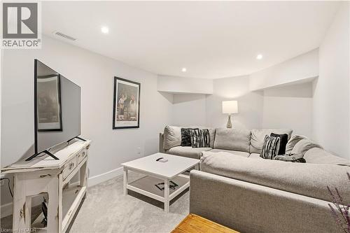 Living area featuring recessed lighting and light colored carpet - 697 Lambshead Drive, Burlington, ON - Indoor Photo Showing Living Room