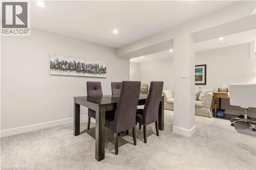 Dining room featuring light carpet, recessed lighting, and a desk - 697 Lambshead Drive, Burlington, ON - Indoor