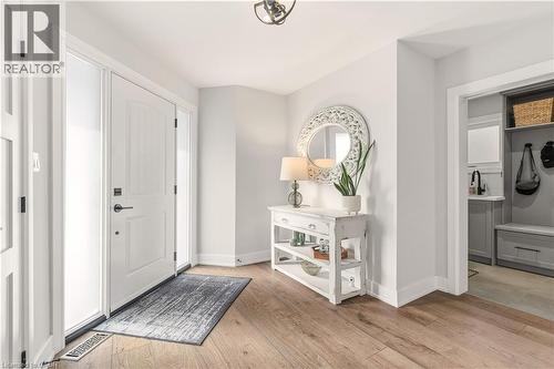 Foyer with light wood-style flooring and baseboards - 697 Lambshead Drive, Burlington, ON - Indoor Photo Showing Other Room