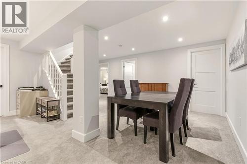 Dining space with stairway, light carpet, and recessed lighting - 697 Lambshead Drive, Burlington, ON - Indoor