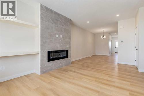 1981 Mccaskill Drive, Crossfield, AB - Indoor Photo Showing Other Room With Fireplace