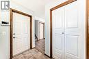 Coat closet and door to garage - 21 Hillview Road, Strathmore, AB  - Indoor Photo Showing Other Room 