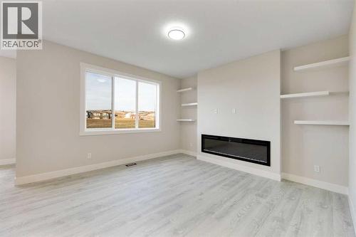 542 Ranch Green, Strathmore, AB - Indoor With Fireplace