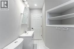 Bathroom featuring vanity and light marble finish floors - 