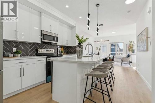 205, 95 Saddlecrest Circle Ne, Calgary, AB - Indoor Photo Showing Kitchen With Upgraded Kitchen