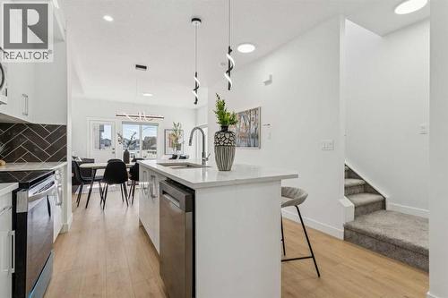 205, 95 Saddlecrest Circle Ne, Calgary, AB - Indoor Photo Showing Kitchen With Upgraded Kitchen