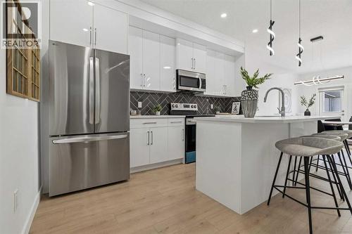 205, 95 Saddlecrest Circle Ne, Calgary, AB - Indoor Photo Showing Kitchen With Stainless Steel Kitchen With Upgraded Kitchen