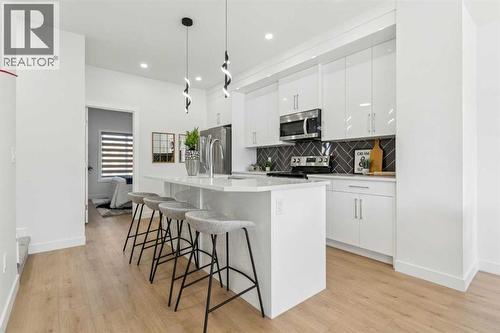 205, 95 Saddlecrest Circle Ne, Calgary, AB - Indoor Photo Showing Kitchen With Upgraded Kitchen