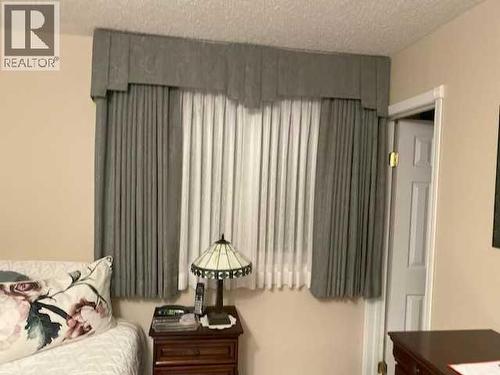 Draperies - 6311 Pineridge Road Ne, Calgary, AB - Indoor Photo Showing Bedroom