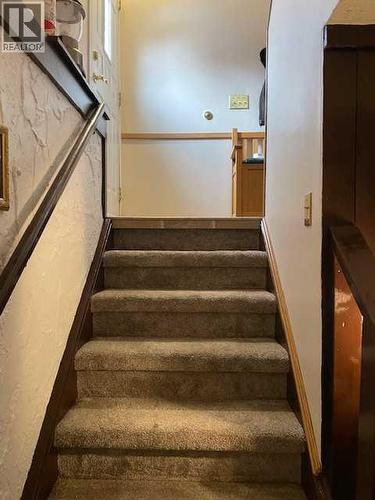 Stairs - 6311 Pineridge Road Ne, Calgary, AB - Indoor Photo Showing Other Room