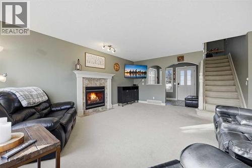 291 Springmere Link Sw, Chestermere, AB - Indoor With Fireplace