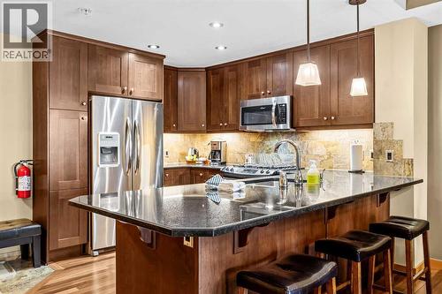 112, 379 Spring Creek Drive, Canmore, AB - Indoor Photo Showing Kitchen With Upgraded Kitchen