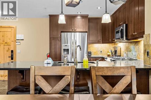 112, 379 Spring Creek Drive, Canmore, AB - Indoor Photo Showing Kitchen With Upgraded Kitchen