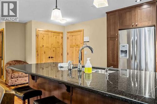 112, 379 Spring Creek Drive, Canmore, AB - Indoor Photo Showing Kitchen With Double Sink