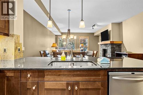 112, 379 Spring Creek Drive, Canmore, AB - Indoor Photo Showing Kitchen With Double Sink