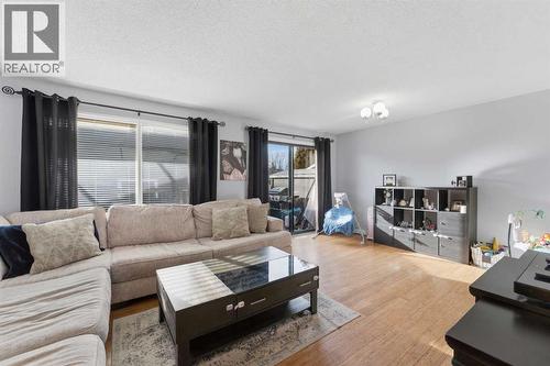 96 Abberfield Crescent Ne, Calgary, AB - Indoor Photo Showing Living Room